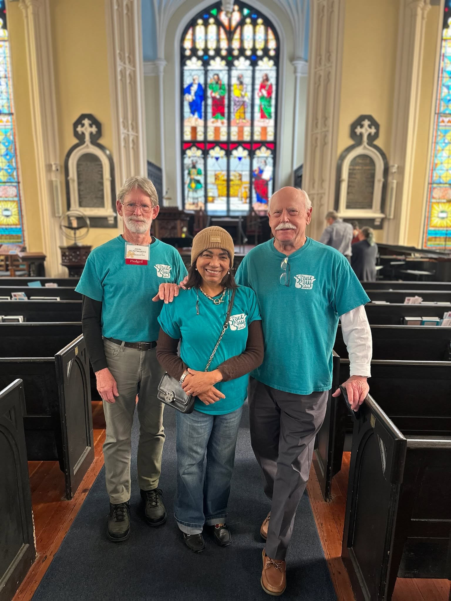 Three Stone Soup Collective volunteers together inside a church